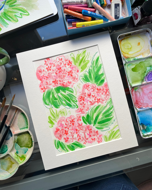 Colourful floral illustration on paper with art supplies around. Inspired by hydrangeas, this piece is free flowing and abstract with little floral elements you would recognise from hydrangea flowers!